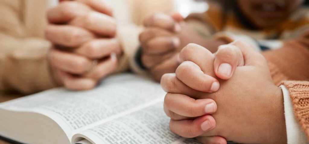 bible, praying or hands of grandmother with children siblings for worship, support or hope in chris