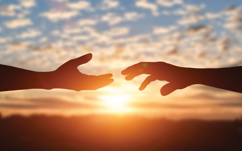 Hands reach to each other